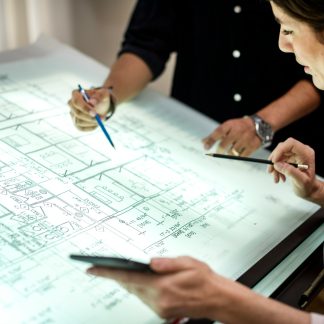 Architect Reviewing Building Information on Screen